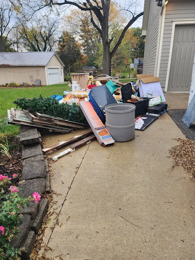 Dumpster being loaded with debris for Residential Dumpster Rental in Westwego